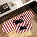 Set of two red and white striped non-slip kitchen mats featuring a cute cartoon black cat - Oval Cartoon Stripe Style A / 40x60cm