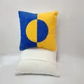Detail of modern blue and yellow color-block square cushion cover with circular design. - Blue Patchwork