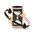 Detailed view of a cute cartoon hourglass enamel pin with pink dripping oil and gold stars - Pink and Black Fantasy Hourglass Brooch (JEWB-R016-01G)