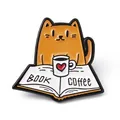 Cute orange cat enamel pin featuring book and coffee mug design for creative lapel decoration - Reading Cat Coffee Brooch (JEWB-A005-22-05)