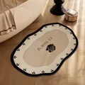 Elegant non-slip bathroom mat with rose design and classical lettering in cream - 30x50cm (Thickened Diatom Mud) / Luxury Chanel Style D (Irregular Cloud)