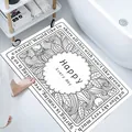 Detailed view of white diatom mud bath mat with black floral pattern and English text - Dewy Hydrangea (Rectangular) / 40*60cm