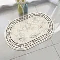 Oval lamb velvet bathroom mat featuring a floral design and inspirational English text. - 40*60cm / Wind and Floral (Oval)