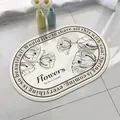Oval lamb velvet bath mat with floral print and English text in a home setting - 40*60cm / Charming Camellia (Oval)