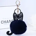 Dunkelblauer Kunstfell-Katzen-Schlüsselanhänger mit schwarzem Kunstlederkopf und Ring - Katze - Dunkelblau
