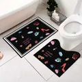 Set di due tappetini da bagno neri con icone a fumetti e tappetino per WC a forma di U - Bellezza