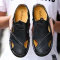 Detailed view of men's leather closed-toe sandals with yellow textured lining - 38 / Black