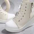 Close-up of women's high-top wedge canvas shoes with side zipper and white platform - 36 / Off White