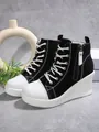 Detailed side view of stylish black and white high-top wedge canvas sneakers for women - 37 / Black