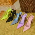 Multiple colors of satin pointed toe slingback pumps displayed on a woven mat - 35 / Blue