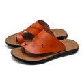 Brown men's PU leather flip-flops featuring ornate cut-out patterns and durable non-slip soles. - Yellow Brown