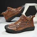 Men's rugged brown leather hiking boots with mesh panels and non-slip rubber soles - 38 / Tan