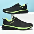 Side view of breathable black fly-knit sneakers with neon green accents and laces - 36 / Black Green