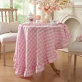 Elegantly draped pink and white gingham round tablecloth with ruffles in a cozy home setting - 120cm / Pink