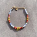 Detailed top-down view of a colorful faceted natural stone beaded bracelet with gold clasp - One Size / Light Blue Red Yellow Cut Stone Style (9) / 17+3cm