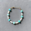 Detailed macro shot of a colorful candy-colored stone beaded bracelet with elegant gold spacers - One Size / Sky Blue Round Bead White Column Bead Style (15) / 17+3cm