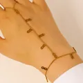 Gold infinity symbol slave bracelet with finger ring and thin chain link design - Infinity Symbol Ring-Linked Bracelet (9811) / Gold