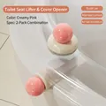 Set of 2 elegant creamy white and pink suction cup toilet seat lifters for bathroom hygiene - Lid Lifter and Opener Set / Two-Piece Set / Creamy White and Pink