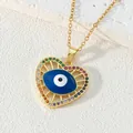 Collana con pendente a cuore in acciaio al titanio dorato con malocchio blu e zirconi - Cuore Occhi Blu con Strass Colorati (Stile 13)