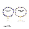 Detailed view of blue and white porcelain beaded bracelets with gold heart and letter A charms - Two-Piece Set / Heart Letter A