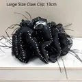 Elegant large 13cm black satin hair claw clip with rhinestones and feather accents. - White Rhinestone Strip Feather