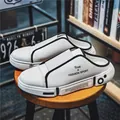 Eleganti sneaker bianche slip-on senza schienale con suola spessa e finiture nere - 35 / Bianco