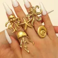 Detailed view of gold stainless steel ocean-themed rings featuring starfish and octopus designs - Ocean 5-Piece Style (39) / 5 Pieces / Gold