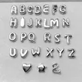 Complete set of 26 polished silver alphabet beads including heart, star, and ampersand charms - Letter A / Silver
