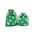 Detail of green faux linen Christmas gift bags with white snowflake pattern and drawstring. - 10*14cm / Green Snowflake