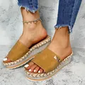 Detail view of stylish women's tan wedge platform sandals with woven rope texture soles. - 35 / Yellow