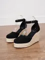 Close-up of black closed-toe espadrille wedge sandals with rope platforms - 34 / Black