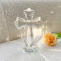 Detailed view of a faceted crystal cross ornament with elegant rainbow light effects - 15.5cm/206g / Clear