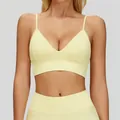 Premium pale yellow V-neck yoga sports bra featuring adjustable thin straps and ribbed texture - S / Tops / Milk Yellow