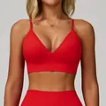 Women's V-neck yoga sports bra in vibrant red with adjustable thin straps. - S / Tops / Red