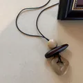 Maillard style long necklace with dark brown wooden and beige textured beads - Division Symbol Irregular Hollow Necklace