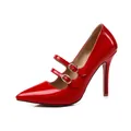 Detailed view of elegant red patent leather pointed-toe stiletto heels with gold buckles - 34 / Red