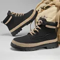 Durable men's black high-top Martin boots with a thick lug sole and stylish tan laces. - 39 / Black