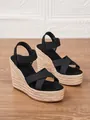 Sandalias de cuña negras para mujer con plataforma de paja trenzada y tiras cruzadas. - Negro