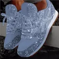Detail view of sparkling light blue rhinestone sneakers with thick platform soles - Light Blue