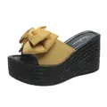 Macro view of yellow bowknot detail and woven texture platform on wedge sandals - 34 / Yellow