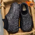 Detail of black graffiti fleece-lined slippers with knit sock cuff and thick sole - Black