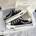 Women's black canvas platform sneakers with braided rope details and thick white soles - 35 / Black