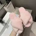 Close-up detail of soft pink faux fur cross-strap indoor slippers with non-slip sole - 38 / Light Pink