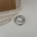 Minimalist silver-plated copper rings featuring a geometric nested circle design - Double Loop Open Ring / Silver