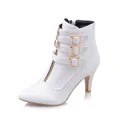 Close-up of elegant white pointed-toe ankle boot with buckle straps and front zipper - 34 / White