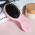 Detail showing mixed boar bristles and nylon pins of the pink massage hairbrush - Pink
