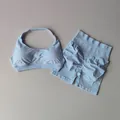 Completo sportivo due pezzi celeste con reggiseno allacciato al collo e shorts a vita alta - Azzurro