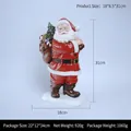 Statuetta di Babbo Natale in resina per decorazioni da tavolo con dimensioni - Babbo Natale che porta regali (RRW106-A) / Rosso bianco