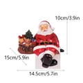 Festive Christmas Santa Claus resin figurine decoration with dimensions 14.5x10x15cm - Right Side Gift Bag Style