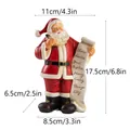Statuina Babbo Natale in resina con pergamena nomi, altezza 17,5 cm. - Babbo Natale che Scrive la Lista - Rosso Piccolo (RRW120-RD-S) / Rosso